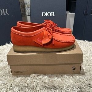 Clark Wallabee’s in red suede gently used, worn maybe twice.